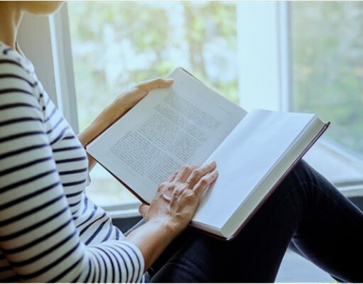 Must-Read Books to Understand the Comfort Women Issue Woman reading a history book by a window, representing research into comfort women history, East Asian wartime historiography, archival sources, survivor testimony, and books about the comfort women debate between Japan and Korea.